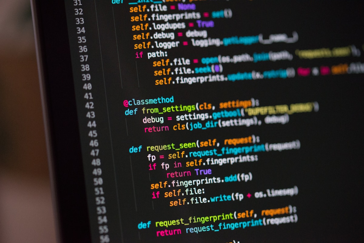Developer working on a technical project at a laptop